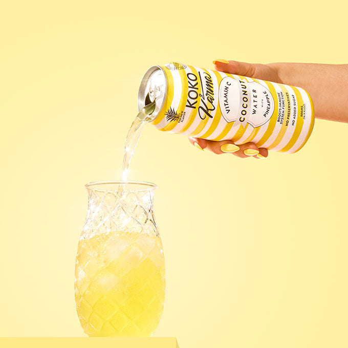 Pouring Coconut water with pineapple