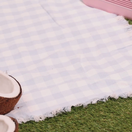 Koko & Karma Lychee coconut water poured at a picnic