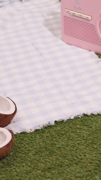 Koko & Karma Lychee coconut water poured at a picnic